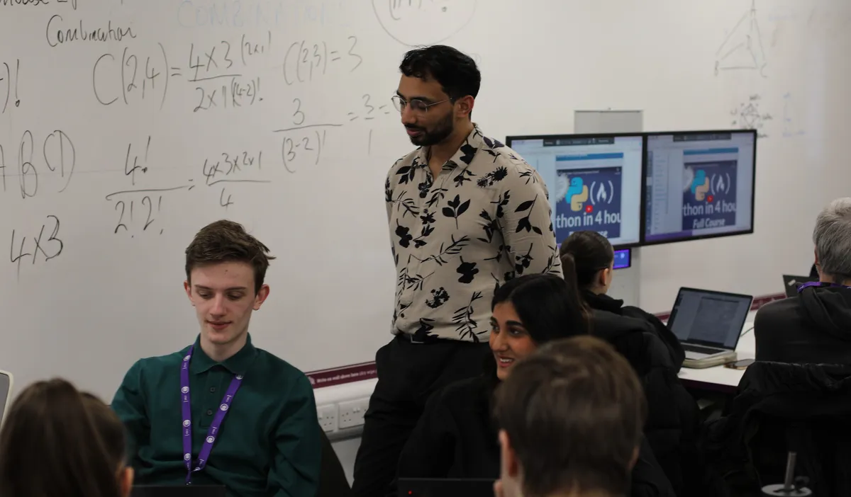 Iman Hussain teaching in a classroom